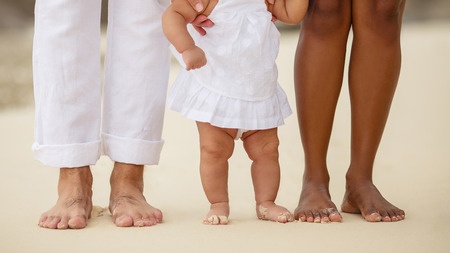 27547151 - cute newborn foot with family members